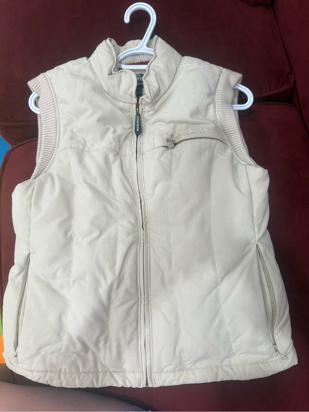 Beautiful Woolrich women’s insulated vest in a light cream/beige color